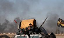 Iraqi special forces members rests during a battle with Islamic State fighters on the outskirts of Mosul, Iraq, February 25, 2017. PHOTO BY REUTERS/Goran Tomasevic