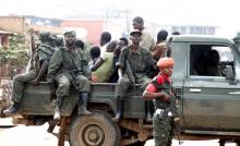 Congolese soldiers ride on their pick-up truck after dispersing civilians protesting against the government's failure to stop the killings and inter-ethnic tensions in the town of Butembo, North Kivu province in the Democratic Republic of Congo, August 24, 2016. REUTERS/Kenny Katombe