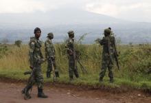 Soldiers from the Democratic Republic of Congo (DRC) look at the distant hills near the town of Kibumba at its border with Rwanda after fighting broke out in the Eastern Congo town. PHOTO BY REUTERS/Kenny Katombe