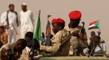 Paramilitary Rapid Support Forces (RSF) soldiers secure the area as they wait for the arrival of Lieutenant General Mohamed Hamdan Dagalo, deputy head of the military council and head of RSF, before a meeting in Aprag village, 60 kilometers away from Khartoum, Sudan, June 22, 2019. PHOTO BY REUTERS/Umit Bektas