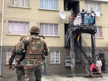 Soldiers patrol as they are deployed to quell gang violence in Manenberg township, Cape Town, South Africa, July 18, 2019. PHOTO BY REUTERS/Shafiek Tassiem