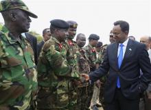 Somalia's Prime Minister Abdi Farah Shirdon Saaid (R) meets senior military officials upon arrival at the passing out parade of newly trained soldiers in Mogadishu