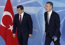 NATO Secretary-General Jens Stoltenberg (R) welcomes Turkish Prime Minister Ahmet Davutoglu at the Alliance headquarters in Brussels, Belgium, November 30, 2015. PHOTO BY REUTERS/Francois Lenoir