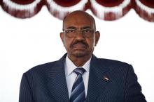 Sudanese President Omar Hassan al-Bashir stands for the national anthem on arrival at Bole International airport