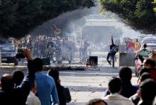 Supporters and opponents of ousted Egyptian President Mohamed Mursi clash at the main university in Alexandria