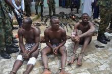 Suspected members of the Niger Delta Avengers are seen as they are paraded by the Nigeria military after their arrest in the Nembe waters, Rivers, Nigeria, August 22, 2016. PHOTO BY REUTERS/Stringer