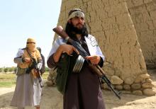 Taliban walk as they celebrate ceasefire in Ghanikhel district of Nangarhar province, Afghanistan, June 16, 2018. PHOTO BY REUTERS/Parwiz