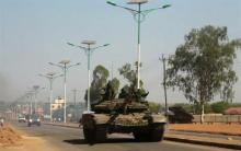 A military tank patrols along one of the main roads in the South Sudanese capital Juba