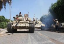 Members of Libyan forces allied with the U.N.-backed ride their tanks during a battle with Islamic State militants in Sirte, Libya, September 6, 2016. PHOTO BY REUTERS/Hani Amara