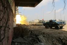 A tank of Iraqi rapid response forces fires against Islamic State militants at the Bab al-Tob area in Mosul, Iraq, March 14, 2017. PHOTO BY REUTERS/Ari Jalal