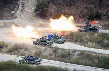 South Korean Army K1A1 and U.S. Army M1A2 tanks fire live rounds during a U.S.-South Korea joint live-fire military exercise, at a training field, near the demilitarized zone, separating the two Koreas in Pocheon, South Korea April 21, 2017. PHOTO BY REUTERS/Kim Hong-Ji