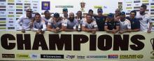 South Africa's cricket team members pose with the trophy after winning the test cricket series against Sri Lanka in Colombo