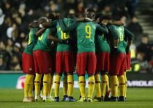 Cameroon team huddle Action. PHOTO BY REUTERS/Andrew Boyers