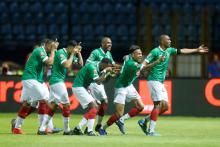 Madagascar's Anicet Abel celebrates their first goal with team mates. PHOTO BY REUTERS/Mohamed Abd El Ghany