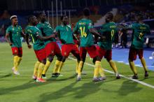 Cameroon's Stephane Bahoken celebrates scoring their second goal with team mates. PHOTO BY REUTERS/Amr Abdallah Dalsh