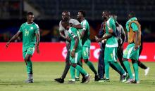 Senegal's Lamine Gassama and team mates celebrate after the match. PHOTO BY REUTERS/Suhaib Salem