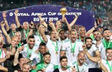 Algeria's Riyad Mahrez lifts the trophy as they celebrate winning the Africa Cup of Nations. PHOTO BY REUTERS/Suhaib Salem