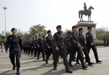 Thai police officers gather at the Royal Plaza near the Government House in Bangkok