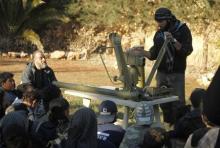 A Free Syrian Army trainer addresses fellow fighters as he conducts a demonstration on how to use anti-tank and anti-aircraft weapons at a training camp in the northern countryside of Aleppo, March 31, 2014. PHOTO BY REUTERS/Ammar Abdullah