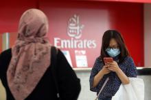 A traveller wears a mask at the Dubai International Airport, after the UAE's Ministry of Health and Community Prevention confirmed the country's first case of coronavirus, in Dubai, United Arab Emirates, January 29, 2020. PHOTO BY REUTERS/Christopher Pike