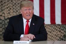 U.S. President Donald Trump speaks to reporters before he meets U.S. political and military leaders during an unannounced visit to Al Asad Air Base, Iraq, December 26, 2018. PHOTO BY REUTERS/Jonathan Ernst