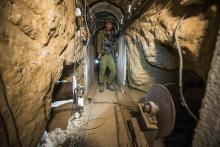An Israeli army officer gives explanations to journalists during an army organised tour in a tunnel said to be used by Palestinian militants for cross-border attacks