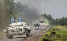 U.N. peacekeepers drive their tank as they patrol past the deserted Kibati village near Goma in the eastern Democratic Republic of Congo, August 7, 2013. PHOTO BY REUTERS/Thomas Mukoya