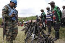 United Nations peace keepers record details of weapons recovered from the Democratic Forces for the Liberation of Rwanda (FDLR) militants after their surrender in Kateku, a small town in eastern region of the Democratic Republic of Congo (DRC), May 30, 2014. PHOTO BY REUTERS/Kenny Katombe