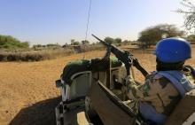 African Union - United Nations Hybrid Operation in Darfur (UNAMID) peacekeepers patrol the damaged and empty Labado village in South Darfur, December 10, 2013. PHOTO BY REUTERS/Mohamed Nureldin Abdallah