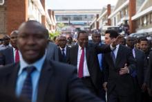 Kenya's President Uhuru Kenyatta gestures as he arrives for visit to the United Aryan Export Processing Zone textile factory in Nairobi, Kenya, April 12, 2017. PHOTO BY REUTERS/Baz Ratner