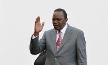 Kenya's President Uhuru Kenyatta salutes guests as he prepares to receive Pope Francis at the State House in Kenya's capital Nairobi, November 25, 2015. PHOTO BY REUTERS/Thomas Mukoya