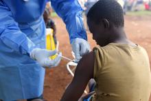 A Congolese health worker administers Ebola vaccine to a boy who had contact with an Ebola sufferer in the village of Mangina in North Kivu province of the Democratic Republic of Congo, August 18, 2018. PHOTO BY REUTERS/Olivia Acland