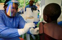 A Ugandan health worker administers the Ebola vaccine to a child in Kirembo village, near the border with the Democratic Republic of Congo in Kasese district, Uganda, June 16, 2019. PHOTO BY REUTERS/James Akena