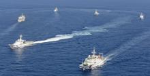 Vessels from the China Maritime Surveillance and the Japan Coast Guard are seen near disputed islands, called Senkaku in Japan and Diaoyu in China, in the East China Sea, September 10, 2013. PHOTO BY REUTERS/Kyodo