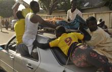 The remains of the Kano central mosque bombing victim is carried on the top of a car from the Murtala Mohammed specialist Hospital for burial according to Muslim rites, in Kano State, November 28, 2014. PHOOTO BY REUTERS/Stringer