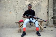 A member of the local militia group, otherwise known as CJTF, Baaka Ahmed, 25, poses for a portrait photograph in a compound in the city of Maiduguri, northern Nigeria, June 5, 2017. PHOTO BY REUTERS/Akintunde Akinleye