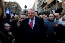Serbian ultra-nationalist leader Vojislav Seselj surrounded by his supporters arrives for an anti-government rally in Belgrade, March 24, 2016. PHOTO BY REUTERS/Marko Djurica