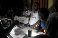 Polling officials count the ballots during a presidential election in Conakry, Guinea, October 11, 2015. PHOTO BY REUTERS/Luc Gnago