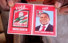 A local holds a card with a picture of Mozambique's president and leader of the Frelimo Party, Filipe Nyusi, ahead of Tuesday's provincial and legislative elections, in Maputo, Mozambique, October 11, 2019. PHOTO BY REUTERS/Grant Lee Neuenburg