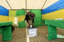 An old man prepares to cast his vote at a polling station in Rwanda's capital Kigali December 18, 2015, during a referendum as Rwandans vote to amend its Constitution to allow President Paul Kagame to seek a third term. PHOTO BY REUTERS/James Akena