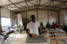 A voter casts his ballot at a polling station during the country's presidential and legislative elections in Niamey, Niger, February 21, 2016. PHOTO BY REUTERS/Joe Penney