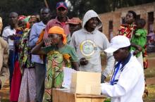 An election official verifies the identity of voters before clearing them to vote at a polling center in Mwumba Commune of Buye hill in Ngozi province, northern Burundi, July 21, 2015. PHOTO BY REUTERS/Evrard Benjamin