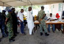 Police and military personnel queue to vote during the presidential election in Banjul, Gambia, December 1, 2016. PHOTO BY REUTERS/Thierry Gouegnon