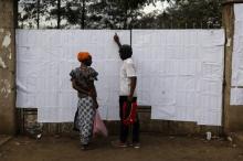 Voters look for their names on an electorate list near a polling station ahead of the presidential election in the slum area of Mathare in the capital Nairobi, Kenya, October 24, 2017. PHOTO BY REUTERS/Siegfried Modola