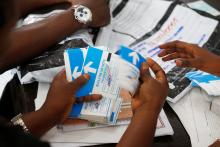 Officials from Congo's Independent National Electoral Commission (CENI) count presidential elections ballots at tallying centre in Kinshasa, Democratic Republic of Congo, January 4, 2019. PHOTO BY REUTERS/Baz Ratner