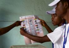 Members of the Burundian National Independent Electoral Commission count votes for the parliamentary elections at a polling station near Musaga neighbourhood in capital Bujumbura, June 29, 2015. PHOTO BY REUTERS/Paulo Nunes dos Santos