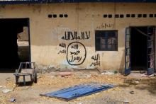 A wall painted by Boko Haram is seen in Damasak, March 24, 2015. PHOTO BY REUTERS/Joe Penney