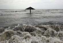 Waves come ashore at Mayangan village in Subang, Indonesia's West Java province, Indonesia, July 16, 2010. PHOTO BY REUTERS/Beawiharta