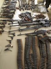 Weapons and ammunition seized from suspected members of Islamist rebel force Boko Haram are displayed during a military patrol in Hausari village, near Maiduguri