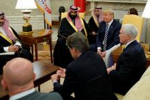 U.S. President Donald Trump, flanked by ‪Vice President Mike Pence‬, welcomes Saudi Arabia's Crown Prince Mohammed bin Salman in the Oval Office at the White House in Washington, U.S., March 20, 2018. PHOTO BY REUTERS/Jonathan Ernst